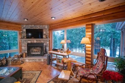 Alger, Michigan home with log siding and knotty pine paneling