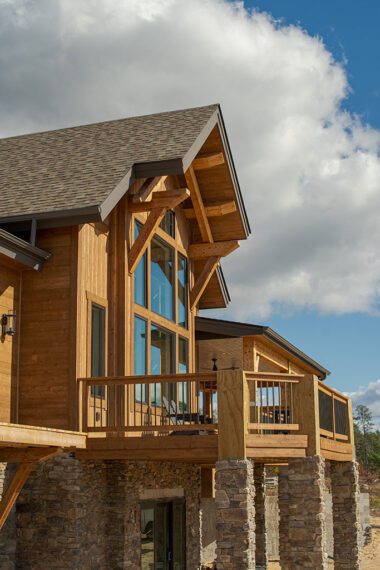Large windows on a modern log cabin