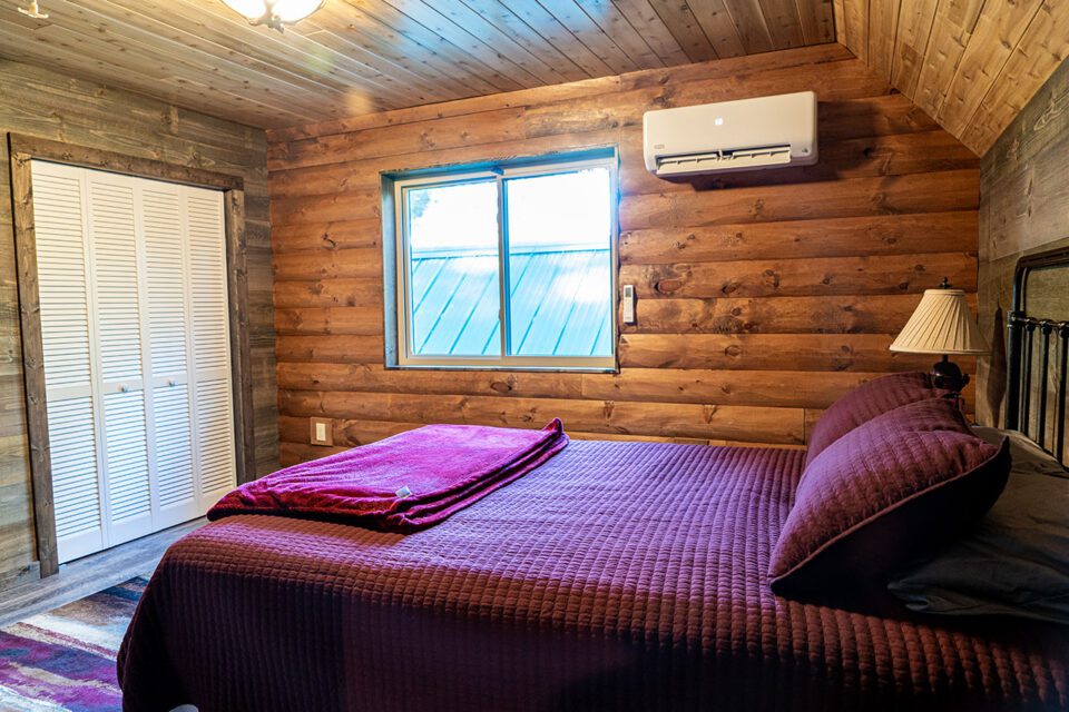 This interior includes both WoodHaven log siding and log paneling!