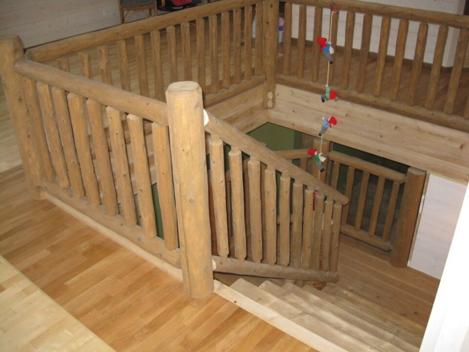 Half log staircase with a cedar railing
