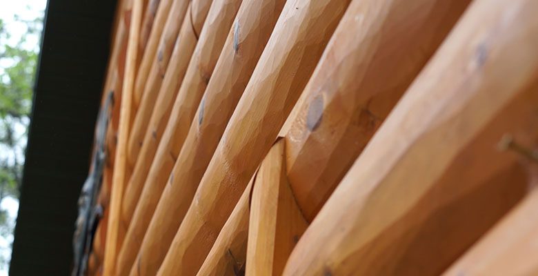 How to Choose Between Hand-Hewn or Smooth Log Siding