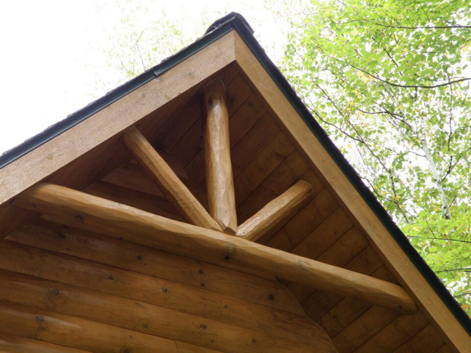 Full log for the double truss and support posts and all pine roof decking