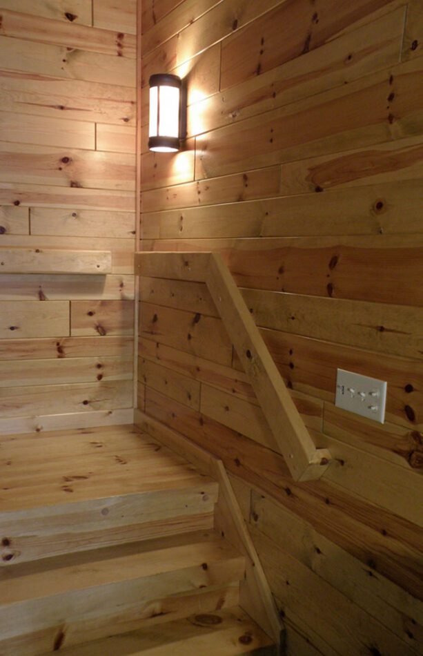 Knotty pine paneling staircase landing