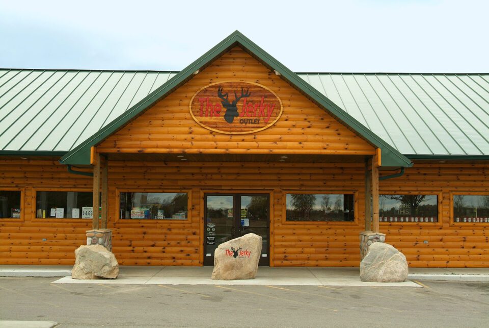 Exterior walls and porch with smooth quarter log siding