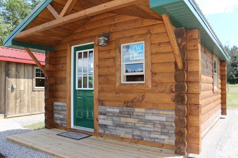 Tiny cabin with quarter-log siding