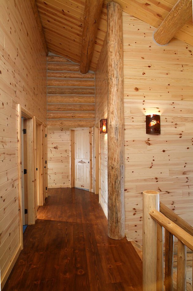 Majestic hallway with WoodHaven knotty pine paneling, doors and trim