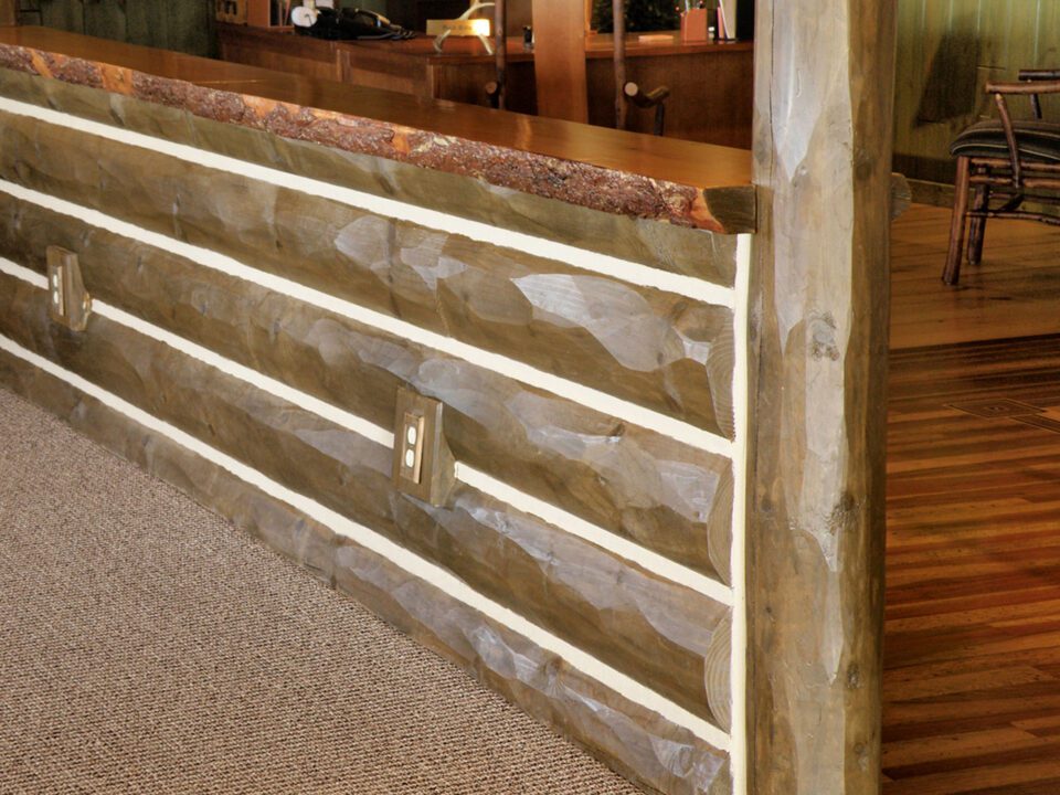 Commercial building with half log hewn with chinking counter