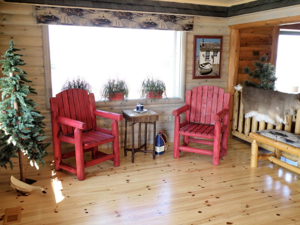 Commercial building with knotty pine natural flooring and quarter log walls