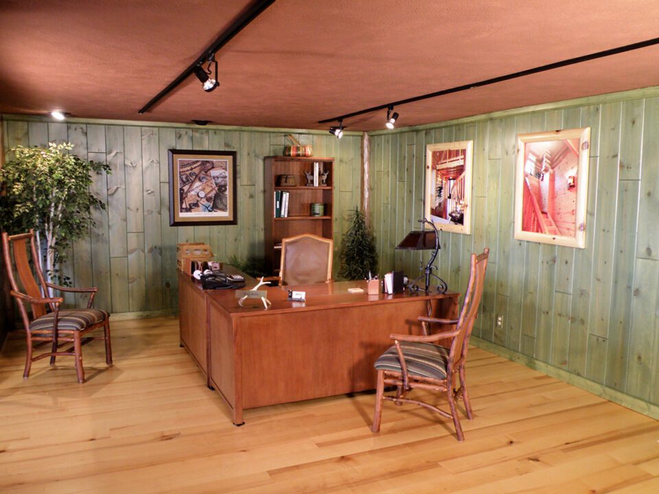 Commercial building with knotty pine walls stained with a semi-transparent green